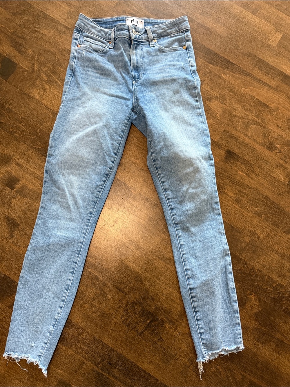 PAIGE Light Wash High-Rise Skinny Jeans with Raw Hem